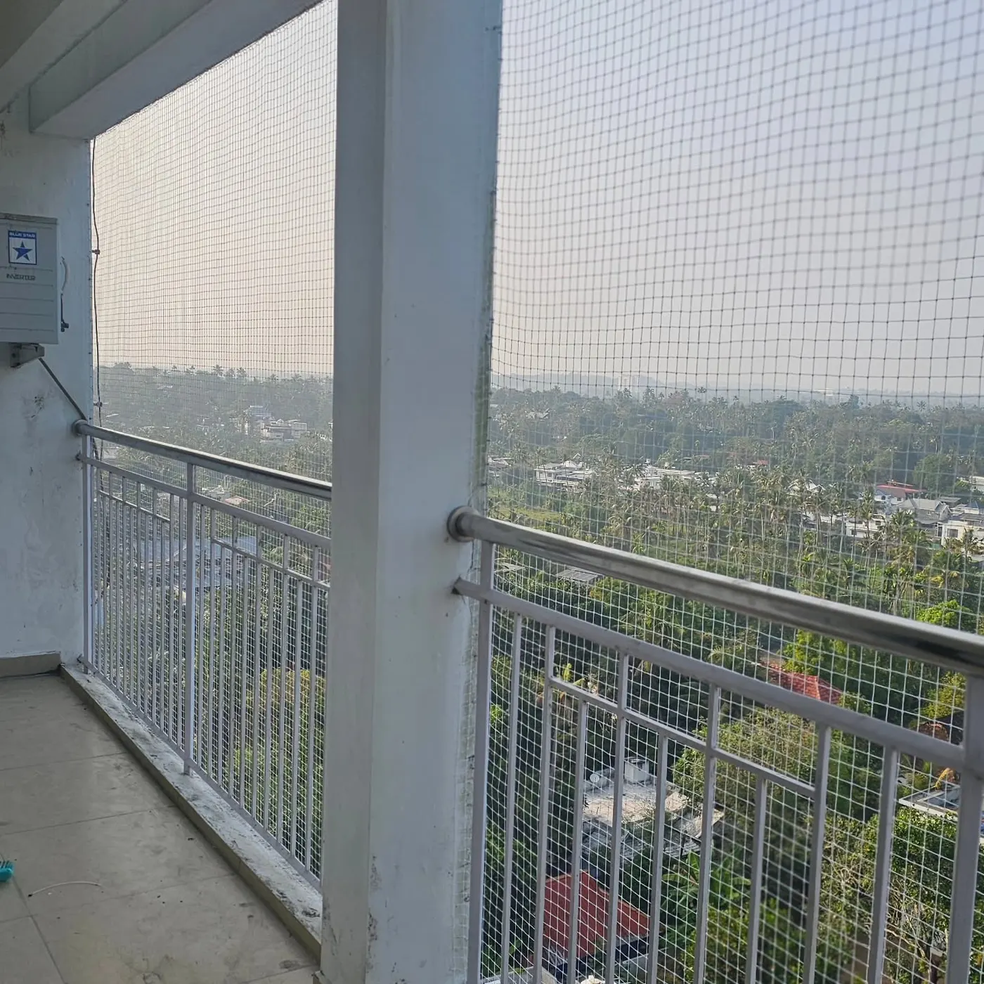 GARWARE HDPE bird and pigeon netting installed on an apartment balcony